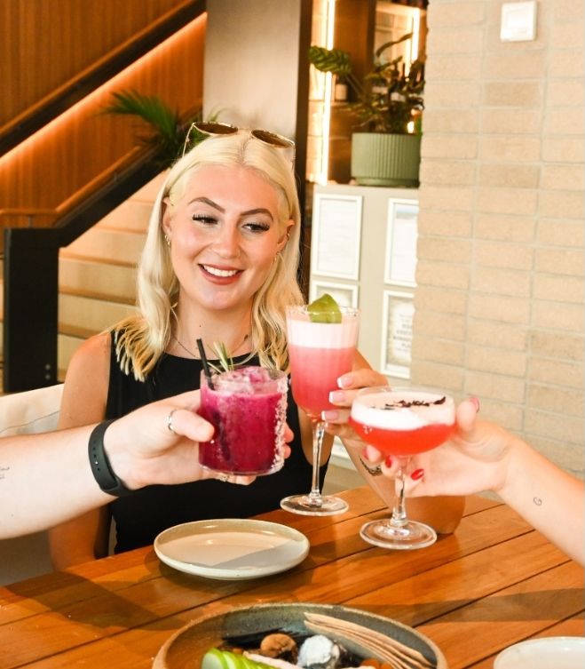 Friends toasting cocktails